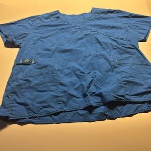 Royal blue scrubs has a stain